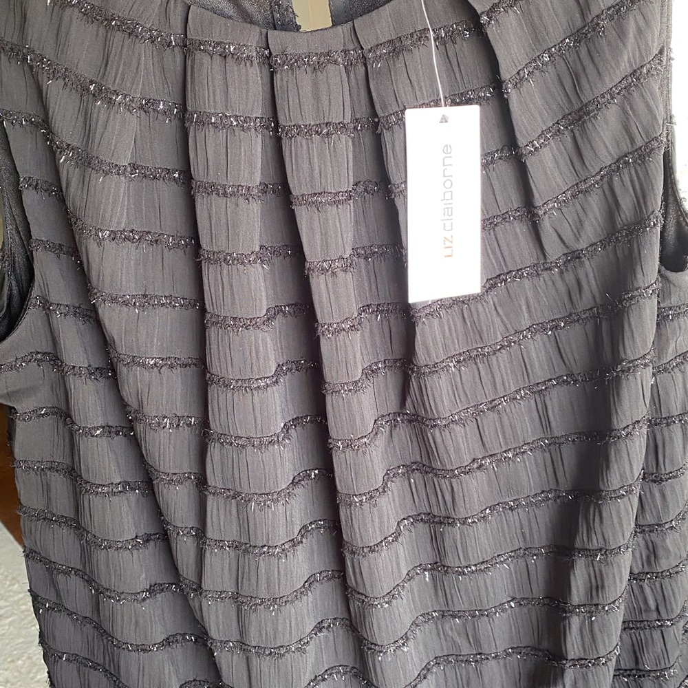 NWT sleeveless black frayed shimmered seams with sparkle.  Lined. Size small
